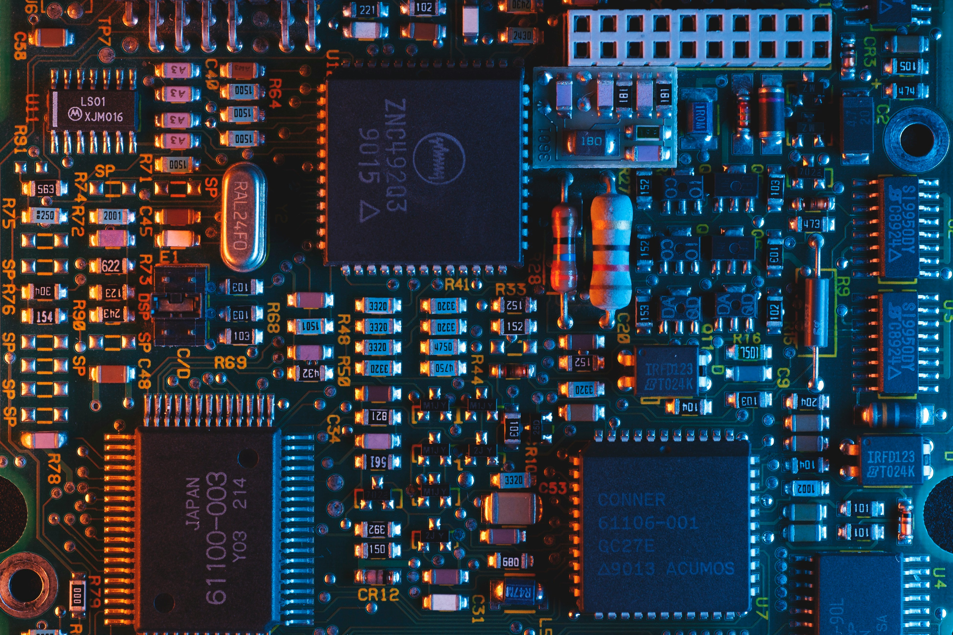 Free Unsplash image of chips on a PCB—because every tech post needs some circuit board eye candy, right?